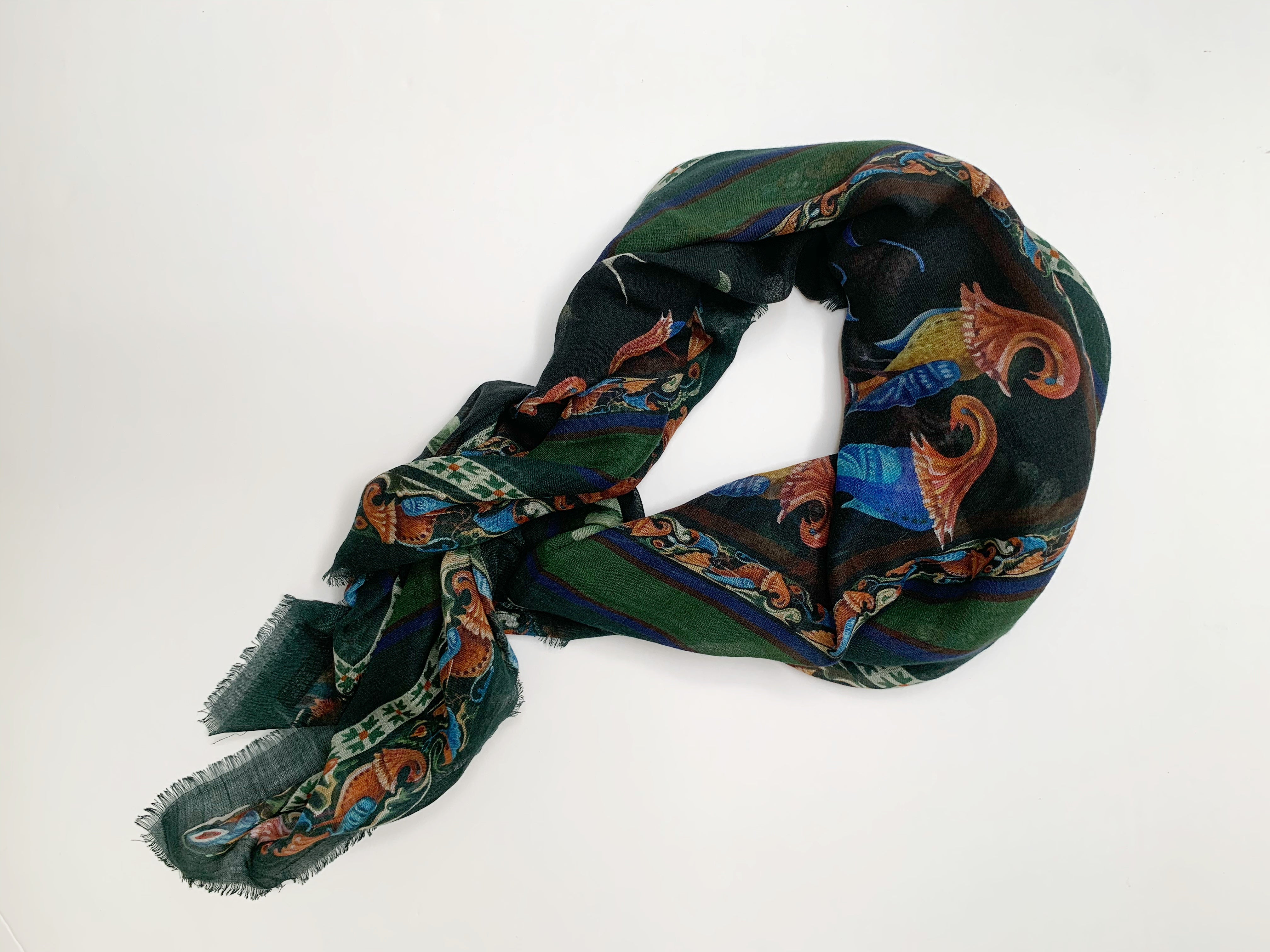 Made in Italy with attention to details. Self fringed scarf with birds that are inspired by ancient manuscripts