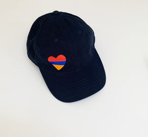 Blue cap with heart red, blue and orange.