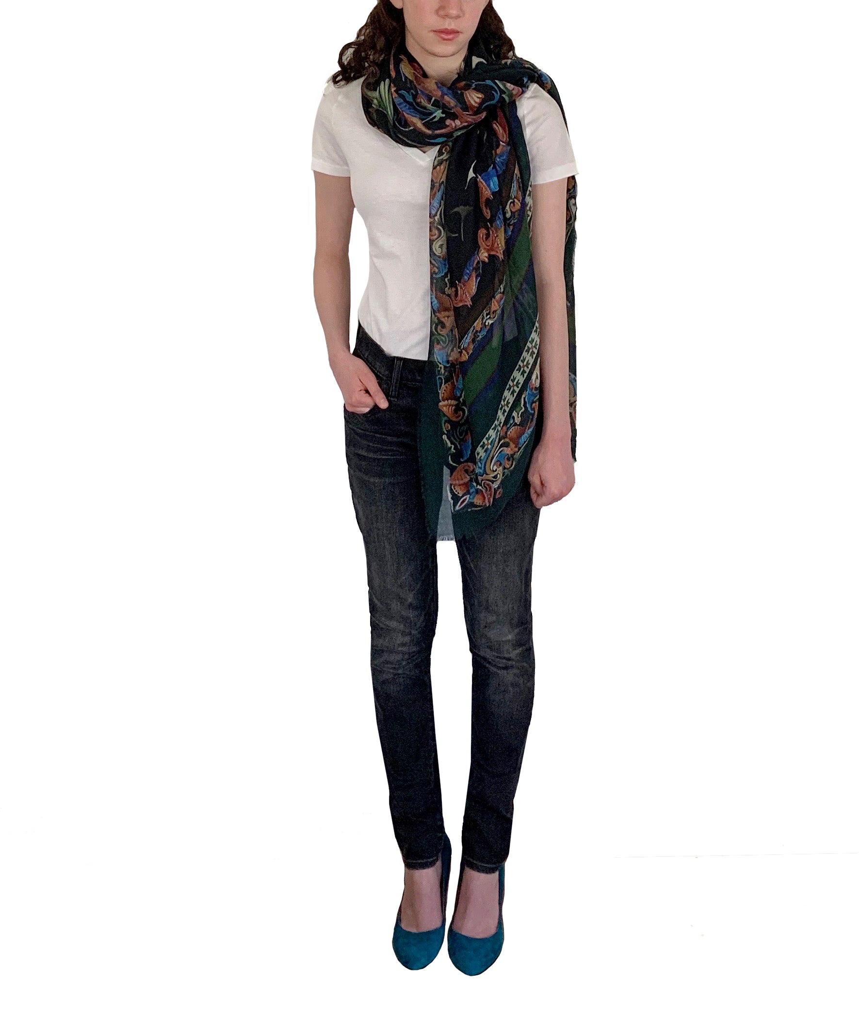 A girl wearing a wool silk scarf draped around her neck with jeans and high heels . The scarf is 55 inches by 55 inches. Made in Italy